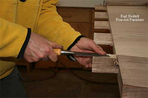Earl chiseling tenons on one end of custom made dining table